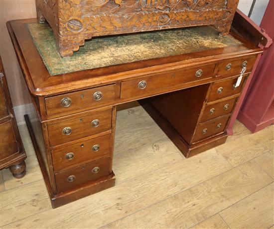 A Victorian mahogany pedestal desk, fitted nine small drawers W.120cm